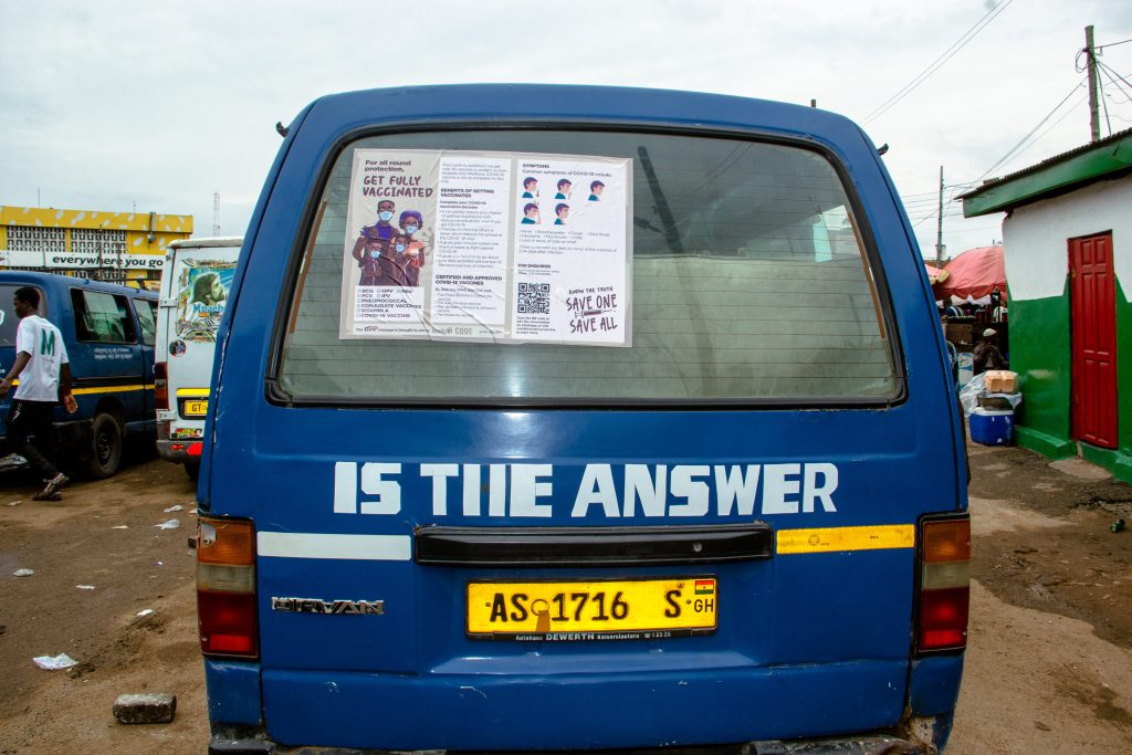 CTAP Get Fully Vaccinated Poster behind a public transport