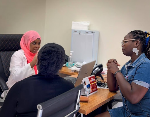 The Country Manager - Jennifer Moffatt and Nancy Avevor receiving education before their screening